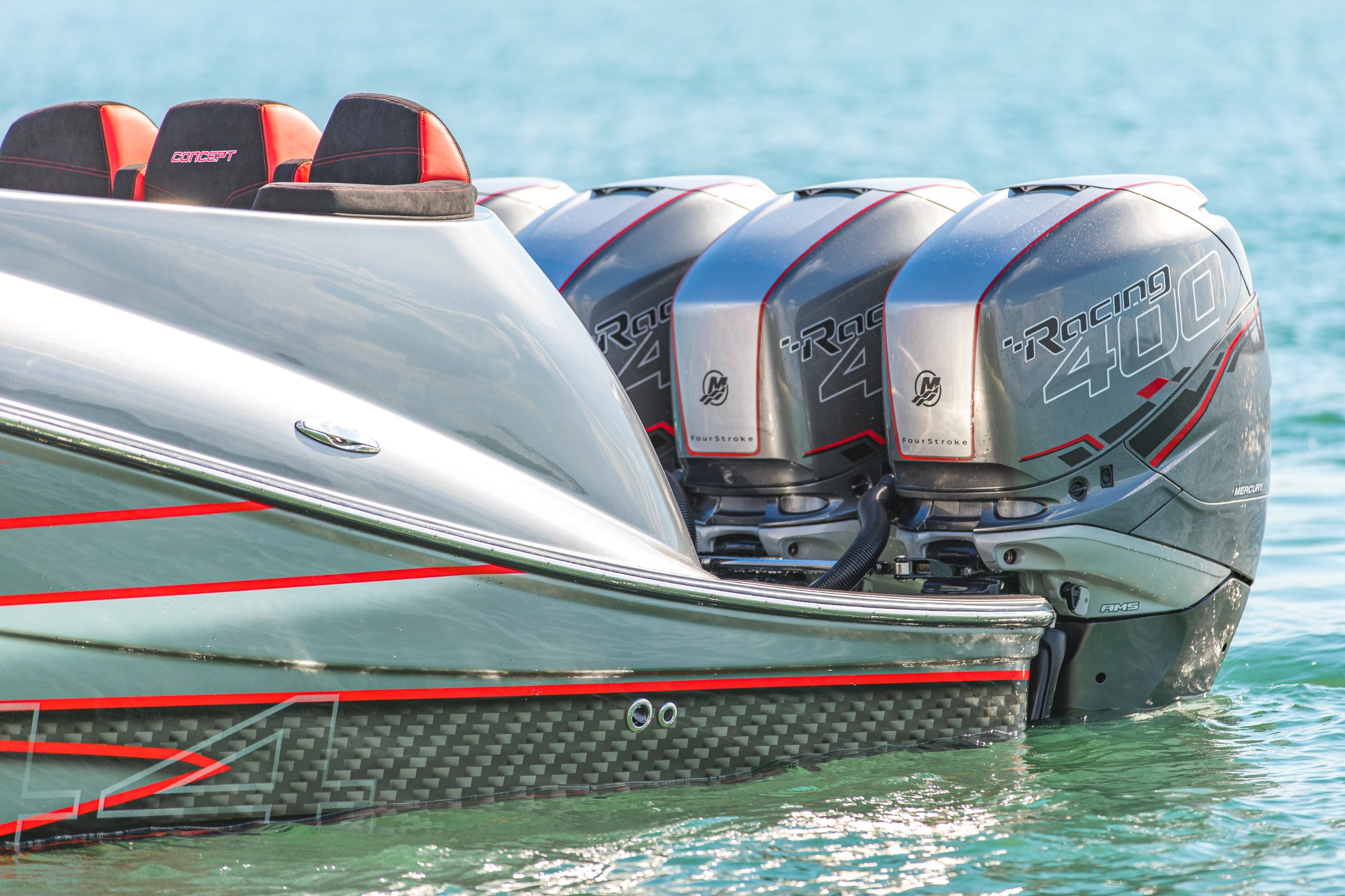 Quad Mercury 400 Verado outboards on the transom of Lucky 13, painted to match the hull